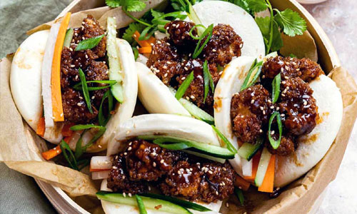 Vegetable Bao buns in a bamboo steamer